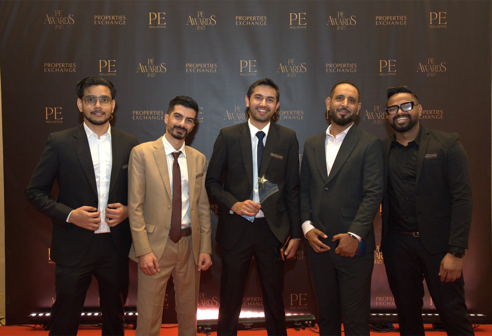 Properties Exchange team with an award at PE Awards 2025